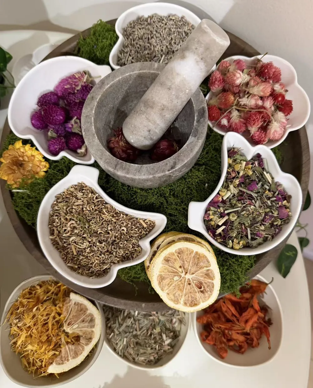 Dried botanical herbs and flowers with a marble mortar and pestle at Jinyue Head Spa in Flushing